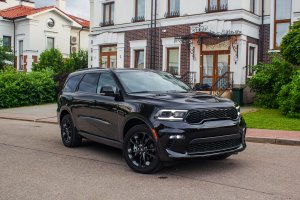 2022 Black Dodge Durango parked on the road in front of a house