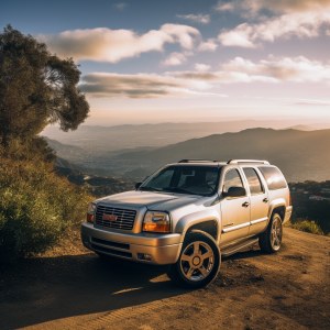 GMC Envoy parked at the mountainside on a bright sunny day