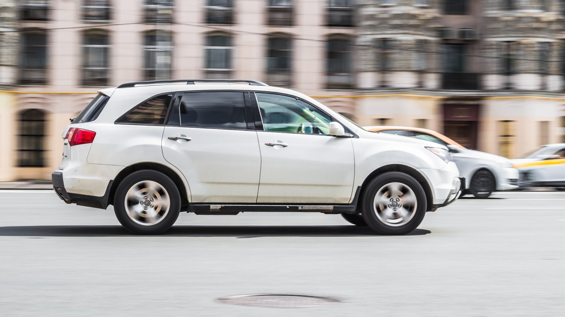 2011 Acura MDX  in motion on city highway road