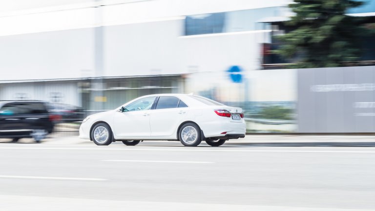 Toyota Camry fast speed drive on city road