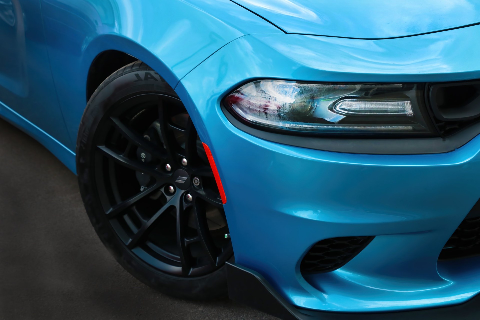 the front of a blue 2018 Dodge Charger