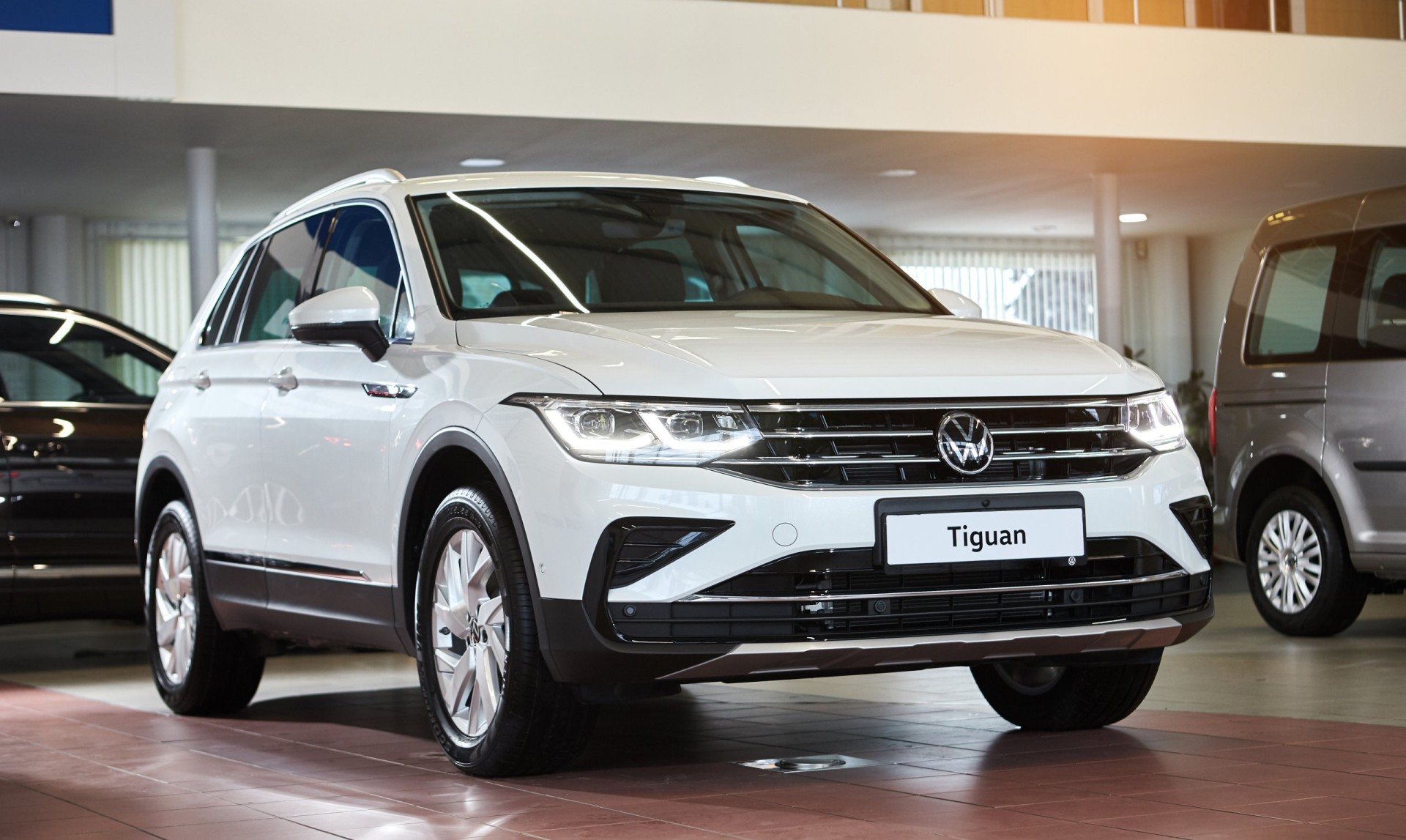 Volkswagen Tiguan 2021 - new model car presentation in showroom - side view