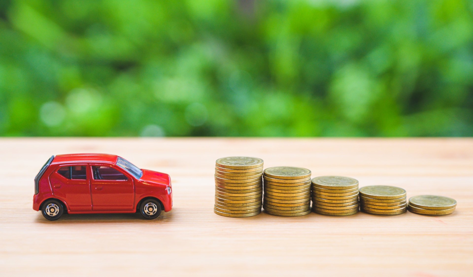 Car and stack of coin. Saving money for car concept. Car finance, buy car new concept.