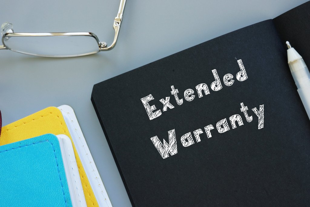 Business concept about Extended Warranty with sign on the sheet.
