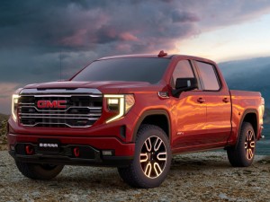 GMC Sierra 1500 AT4 - Off-Road Truck against a mountaintop background