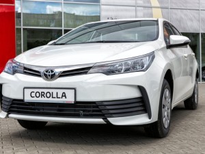 Toyota Corolla on display in front of a motor show