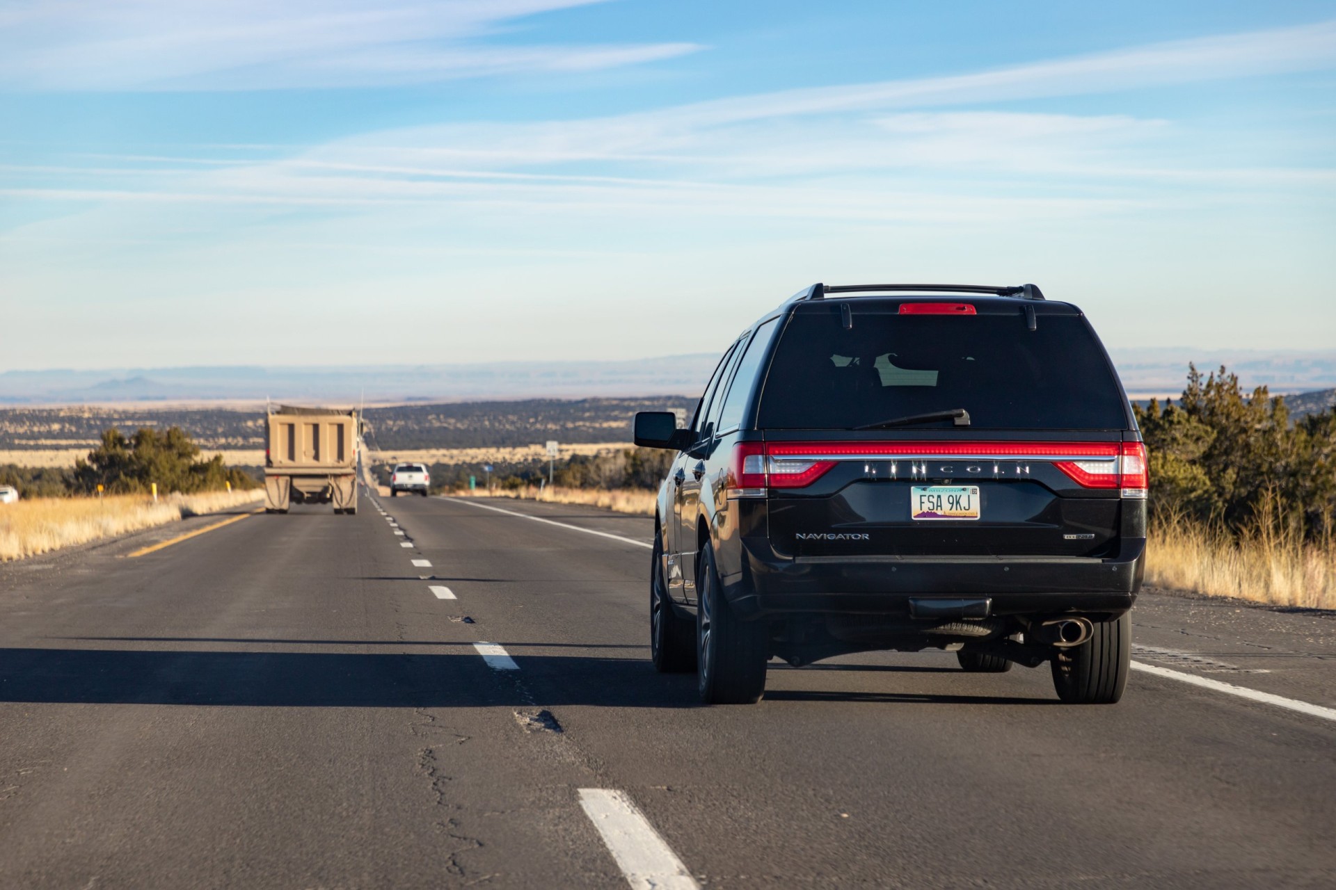 black 2017 Lincoln Navigator EcoBoost driving in Arizona.