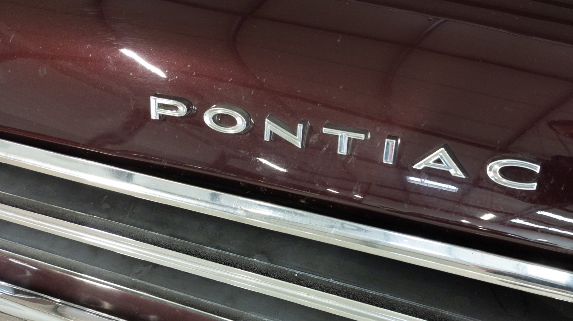 Pontiac logo brand and american sign text on vintage us car