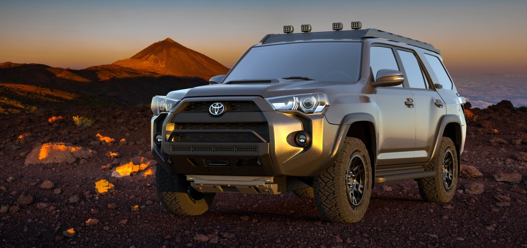 Toyota 4runner SUV with a kayak on roof on a canyon trai