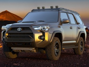 Toyota 4runner SUV with a kayak on roof on a canyon trai