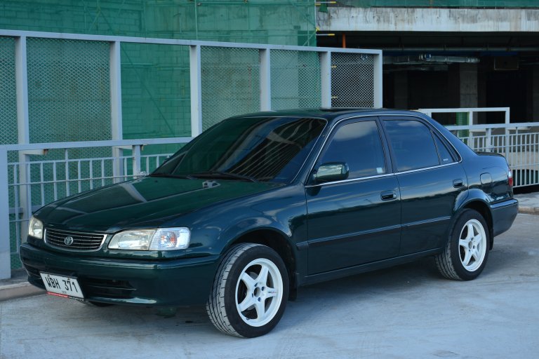 Toyota corolla side parked at an auto show