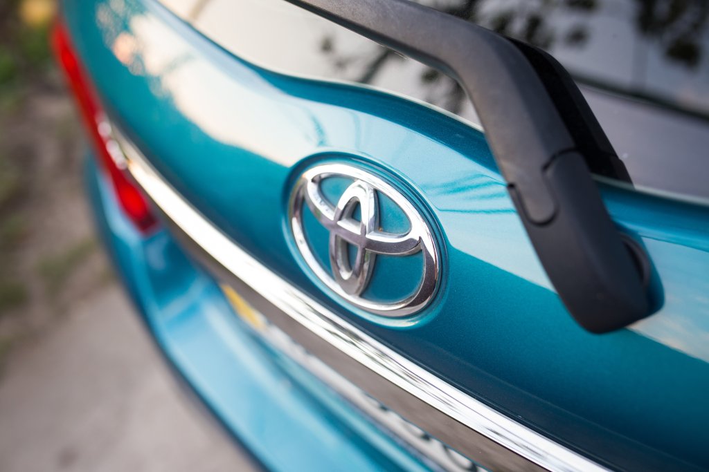 close up detail of the Toyota logo on a car.