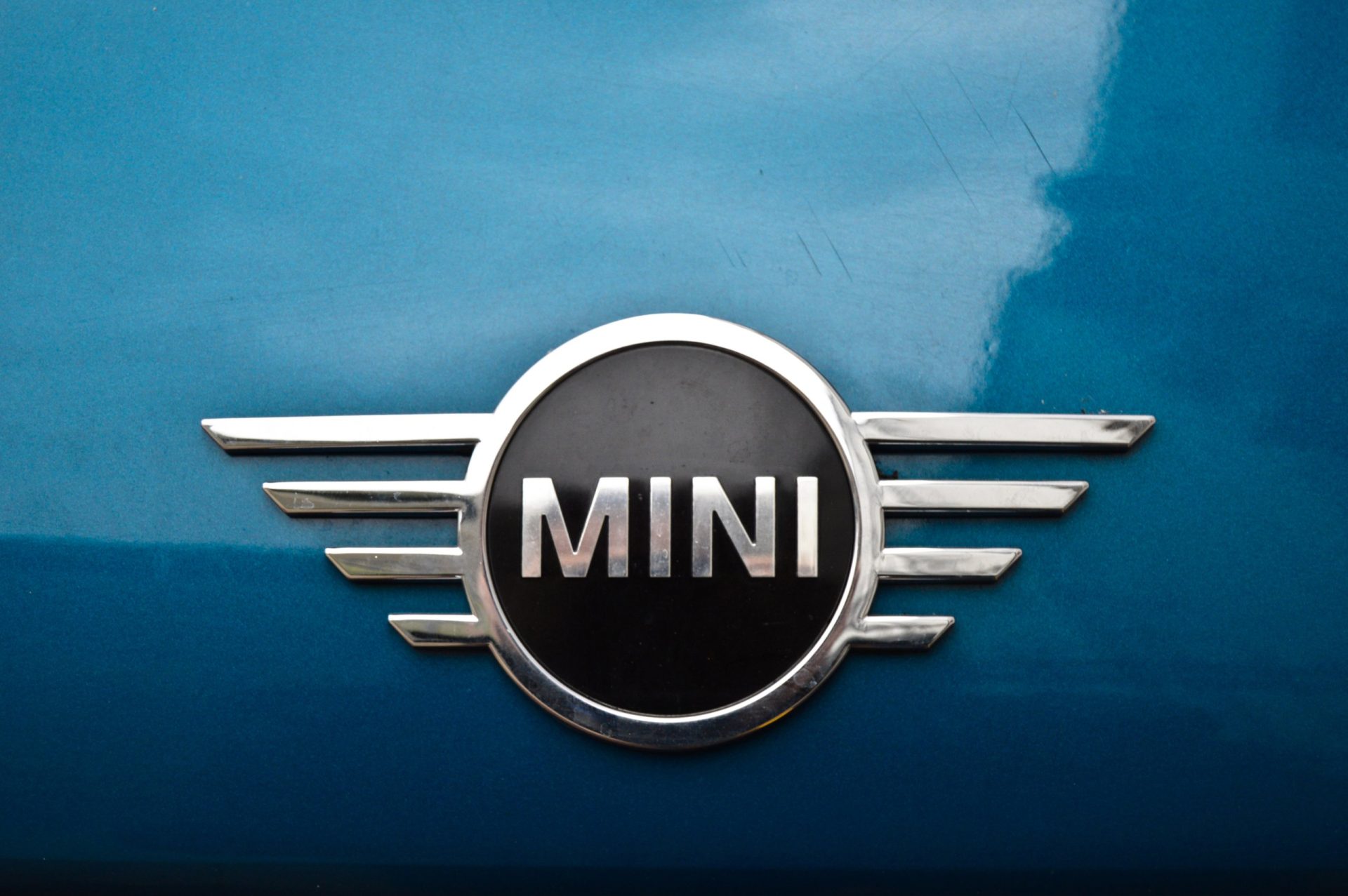 Mini Cooper chrome metal logo, closeup photo