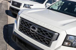 Nissan Frontier pickup truck display, close up photo of front grill